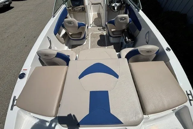 Slide: The Image of 2012 Chaparral 19 H2O Ski & Fish boat interior with beige and blue seating. - 9