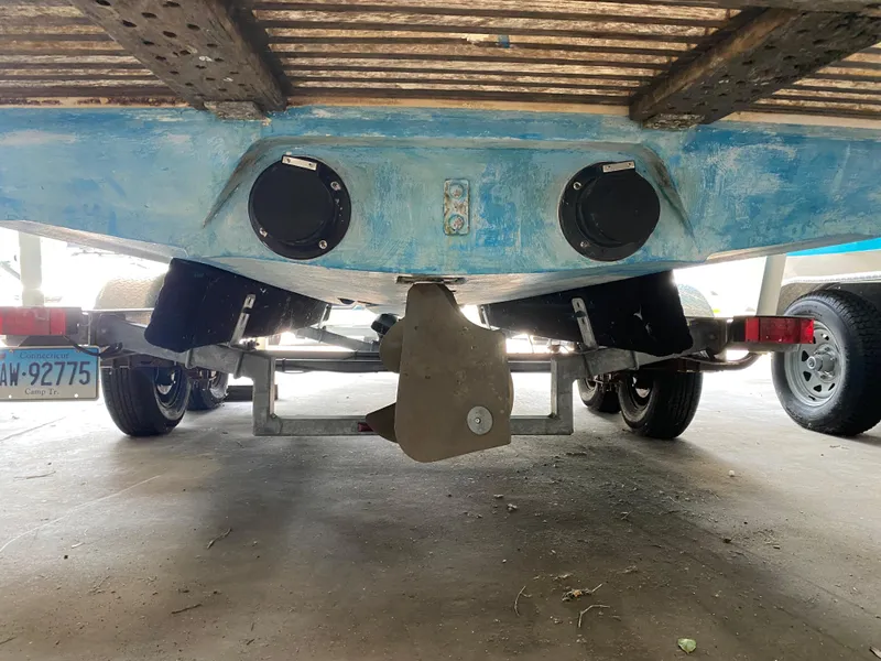 Slide: The Image of Underside of a boat on a trailer, featuring two black covers and a propeller. - 5