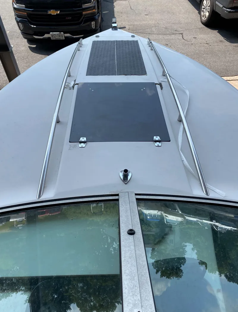 Slide: The Image of The image shows the deck of a 1990 MasterCraft Maristar 240 boat with a skylight. - 19