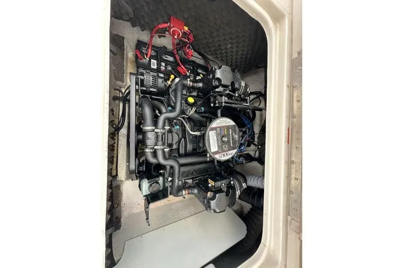 Slide: The Image of Engine compartment of a 2008 Tahoe Q6 Sport boat, showcasing detailed mechanical components. - 25