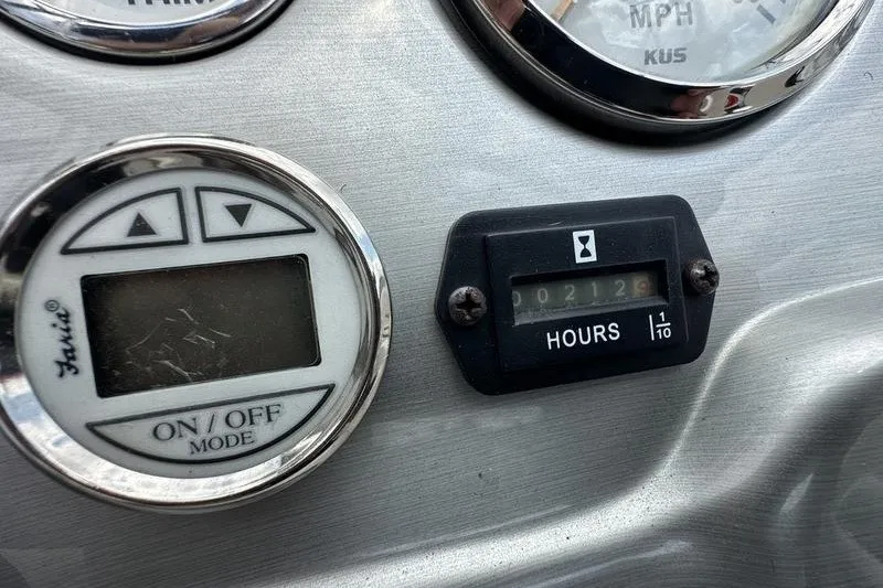 Slide: The Image of Dashboard of 2008 Tahoe Q6 Sport with hour meter and control panel. - 13