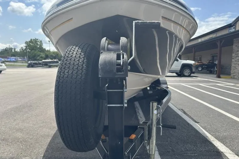 Slide: The Image of 2008 Tahoe Q6 Sport boat on trailer, parked in sunny lot. - 7