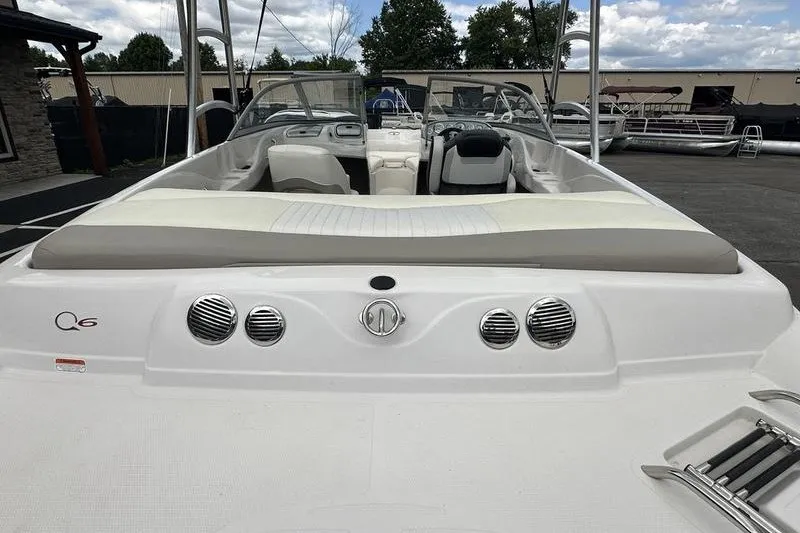 Slide: The Image of 2008 Tahoe Q6 Sport boat interior with seating and dashboard, parked outdoors. - 19