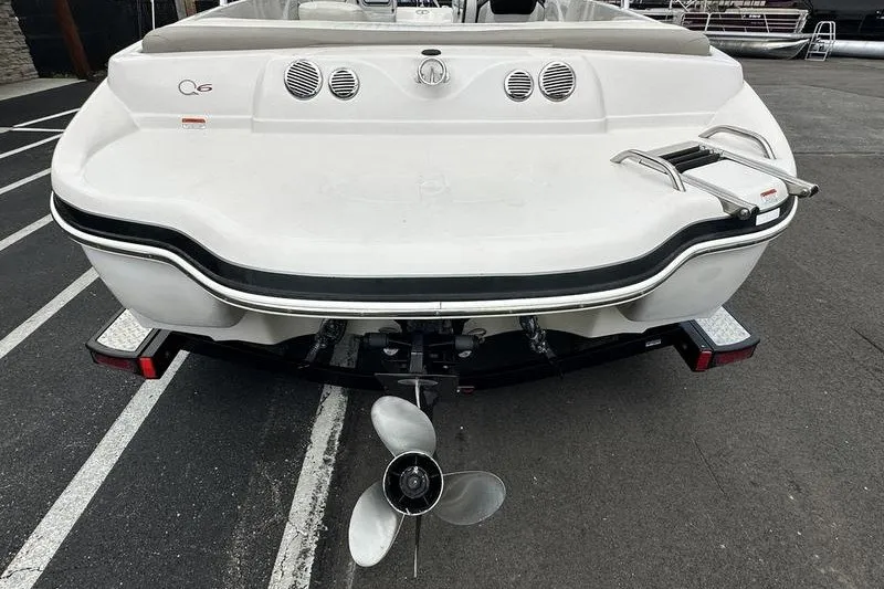 Slide: The Image of Rear view of a 2008 Tahoe Q6 Sport boat with visible propeller and swim platform. - 22