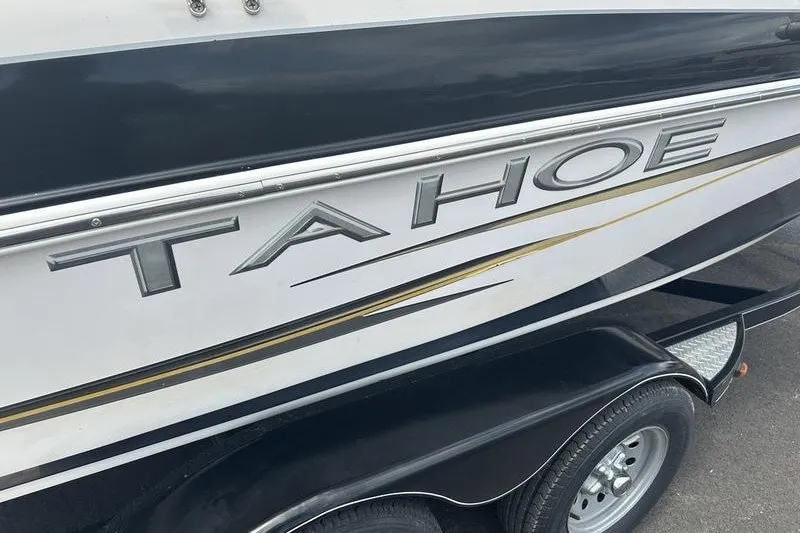 Slide: The Image of 2008 Tahoe Q6 Sport boat side view with logo and trailer. - 9