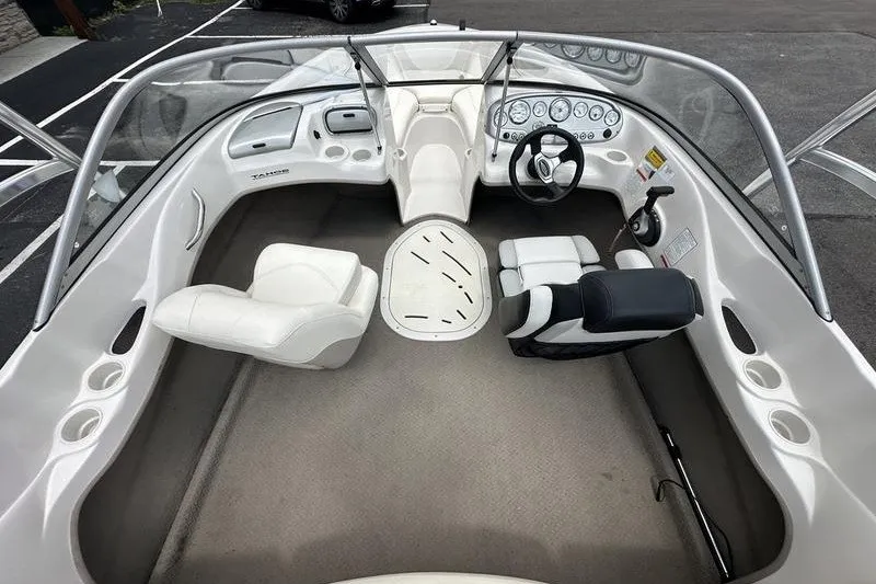 Slide: The Image of 2008 Tahoe Q6 Sport boat interior with steering wheel and seating arrangement. - 16