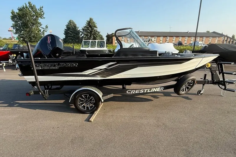 The Image of 2027 Crestliner 1850 Fish Hawk WT boat on trailer, parked outdoors. - 0