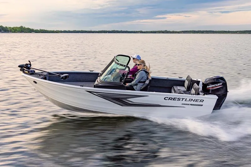 Slide: The Image of Manufacturer Provided Image: 2026 Crestliner 1650 Kodiak WT boat cruising on a serene lake. - 1