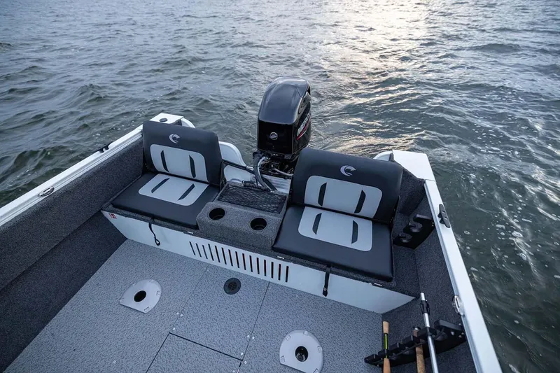 Slide: The Image of Manufacturer Provided Image: 2026 Crestliner 1650 Kodiak WT boat interior with seating and motor on water. - 9