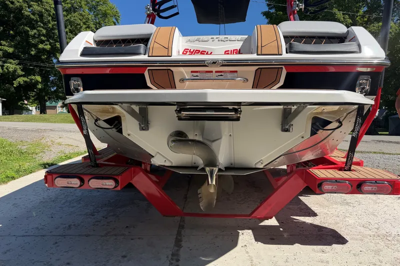 Slide: The Image of 2020 Nautique Super Air Nautique GS20 boat rear view with propeller and platform. - 3