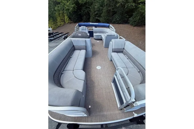 Slide: The Image of 2019 Ranger Reata 200C pontoon boat with spacious seating and carpeted deck. - 10