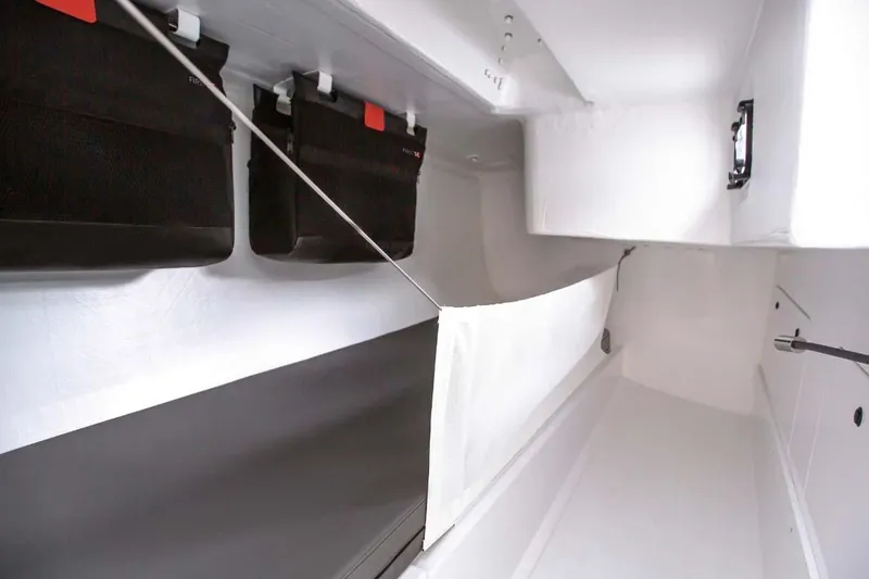Slide: The Image of Manufacturer Provided Image: Interior of 2026 Beneteau FIRST 36 SE sailboat, featuring sleek storage and modern design. - 6