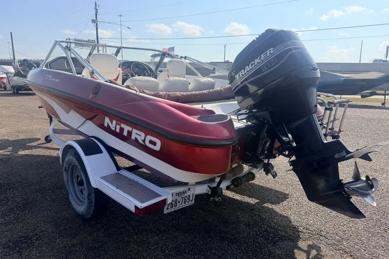 Slide: The Image of 2002 Nitro 175 Sport boat with Tracker 90 engine on trailer, parked outdoors. - 6