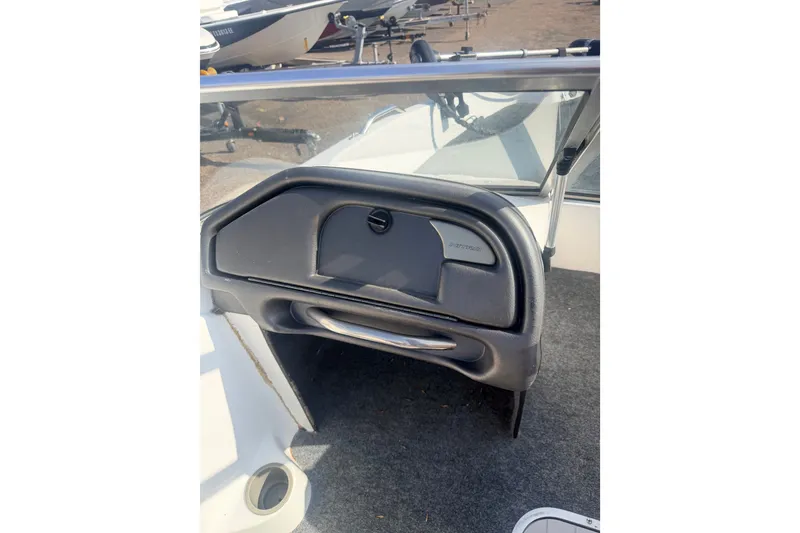 Slide: The Image of 2002 Nitro 175 Sport boat interior with glove compartment and windshield. - 11