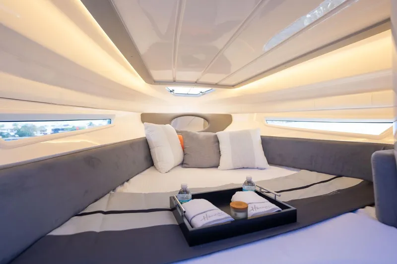 Slide: The Image of Luxurious interior of 2026 Hanover 305 yacht with cozy bedding and ambient lighting. - 9