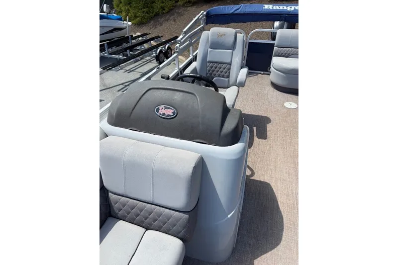 Slide: The Image of The image shows the cockpit of a 2019 Ranger Reata 200C with gray seats and a steering wheel. - 3