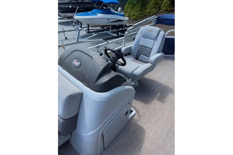 Slide: The Image of The image shows the cockpit of a 2019 Ranger Reata 200C with gray seats and a steering console. - 4