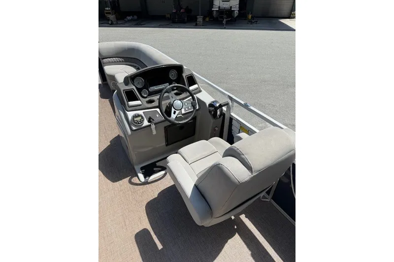 Slide: The Image of The image shows the cockpit of a 2019 Ranger Reata 200C with gray seats and dashboard. - 2