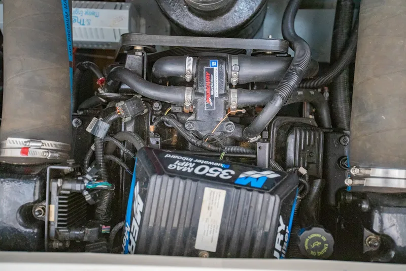 Slide: The Image of Engine compartment of a 2001 Sea Ray Sundancer 310 boat, featuring Mercury components. - 36