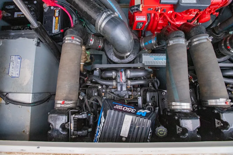 Slide: The Image of Engine compartment of a 2001 Sea Ray Sundancer 310 with visible components and wiring. - 33