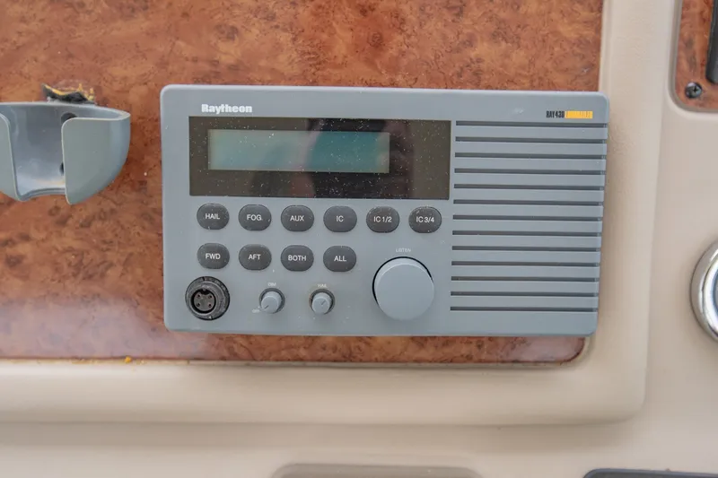 Slide: The Image of Raytheon marine radio on 2001 Sea Ray Sundancer 310 dashboard. - 19