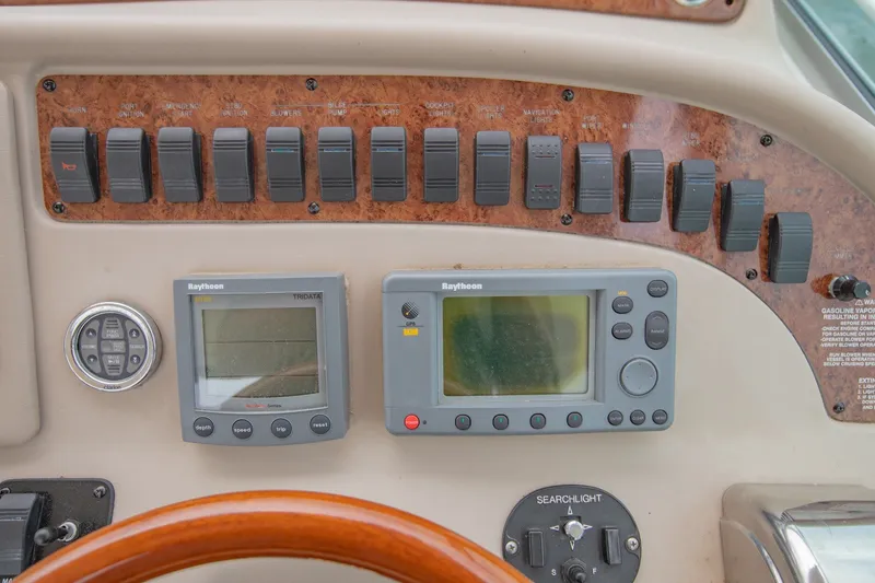 Slide: The Image of Control panel of a 2001 Sea Ray Sundancer 310 boat with navigation instruments. - 20