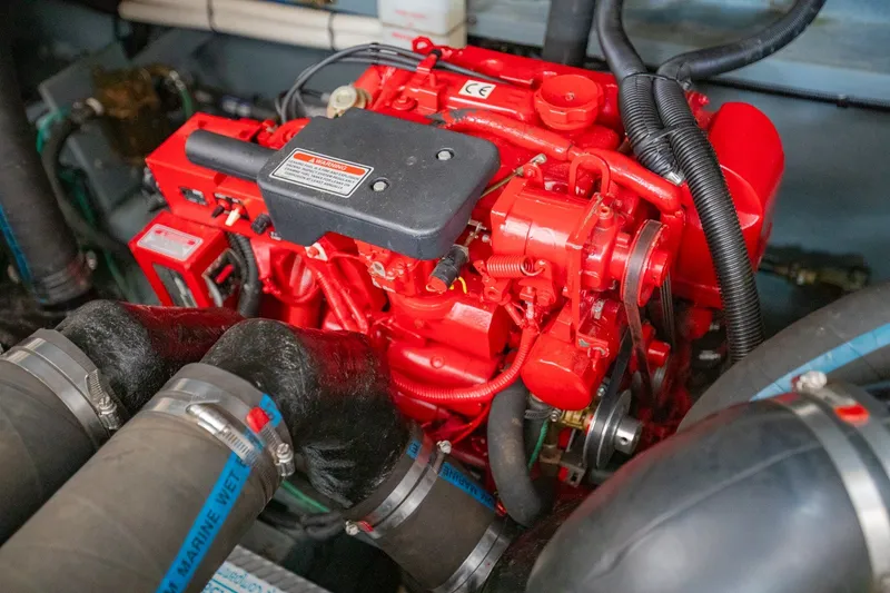 Slide: The Image of Red engine of a 2001 Sea Ray Sundancer 310 boat, showcasing detailed components. - 35