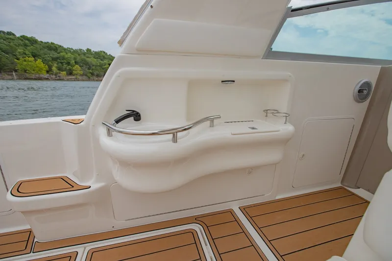 Slide: The Image of 2001 Sea Ray Sundancer 310 boat interior with sink and wooden flooring. - 10
