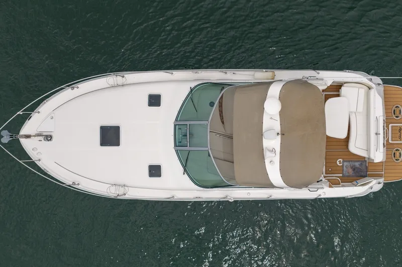 Slide: The Image of Aerial view of 2001 Sea Ray Sundancer 310 yacht on water. - 8