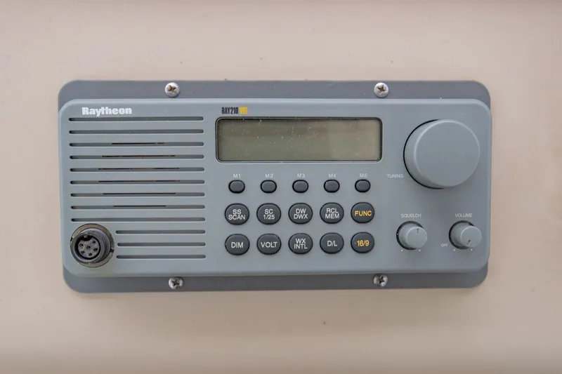 Slide: The Image of Raytheon marine radio on 2001 Sea Ray Sundancer 310 boat dashboard. - 18