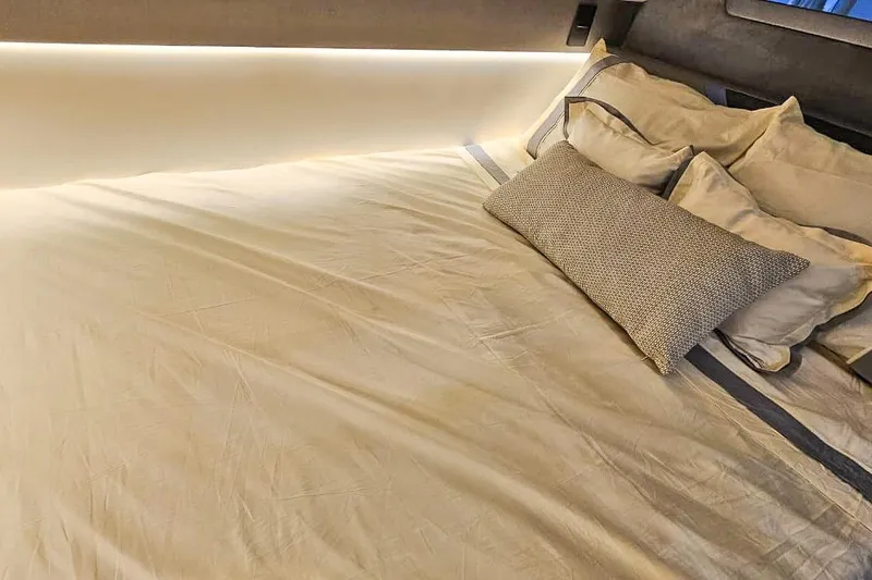 Slide: The Image of Luxurious bed with elegant pillows in a Hanover 327, 2026 model. - 12