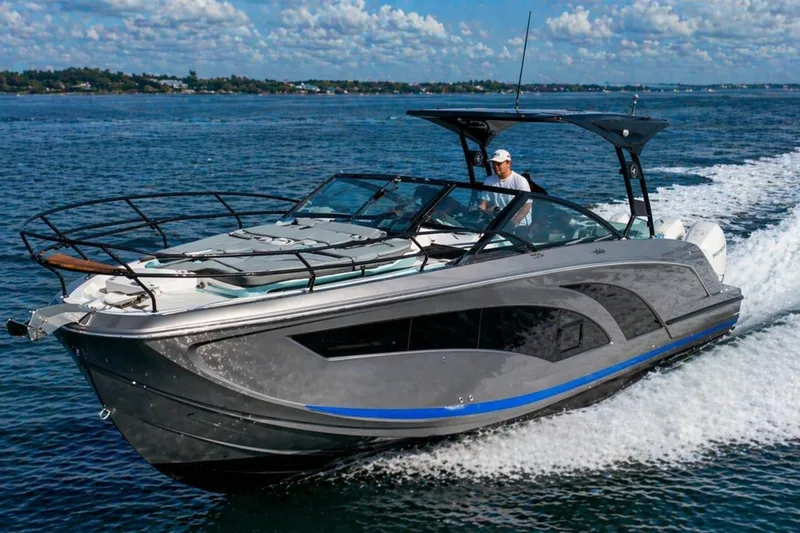 Slide: The Image of Luxury Hanover 327 boat cruising on open water, 2026 model. - 1