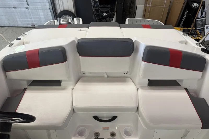 Slide: The Image of 2027 Tahoe T18 boat interior with gray and red cushioned seating. - 9