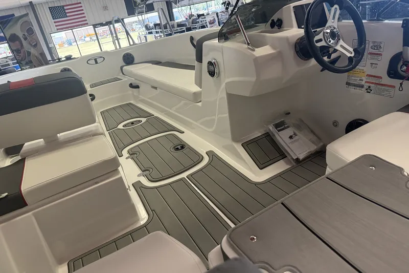 Slide: The Image of Interior of a 2027 Tahoe T18 boat, featuring sleek seating and modern steering controls. - 5