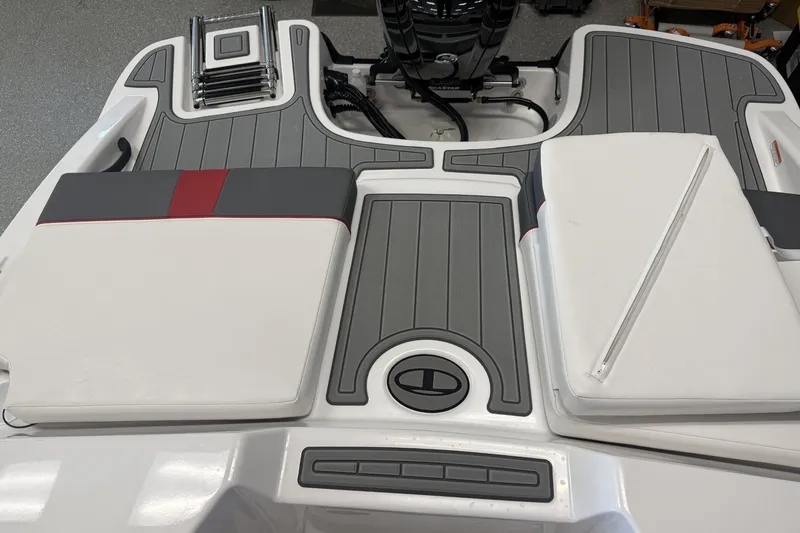 Slide: The Image of 2027 Tahoe T18 boat deck with cushioned seating and integrated ladder. - 10