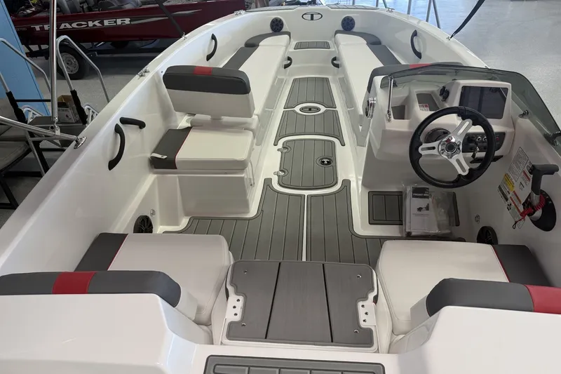 Slide: The Image of 2027 Tahoe T18 boat interior with modern seating and steering console. - 3