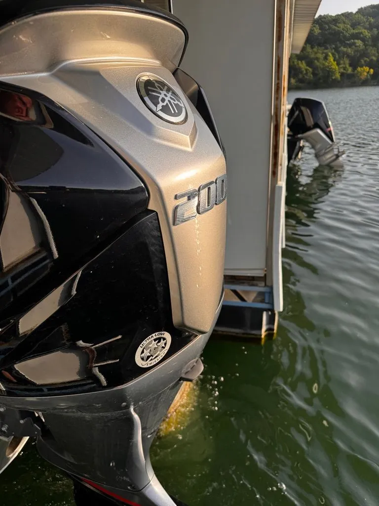Slide: The Image of A Yamaha 200 HP outboard motor on a boat in the water. - 9