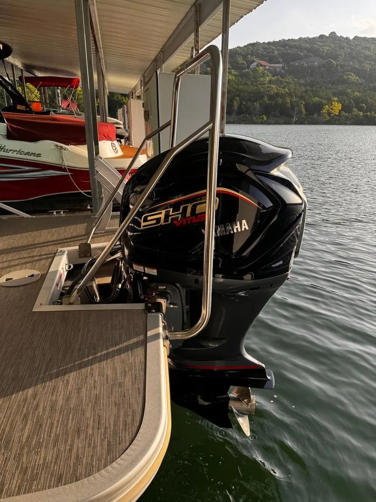 Slide: The Image of A Yamaha outboard motor is attached to a Bennington boat docked at a pier. - 10