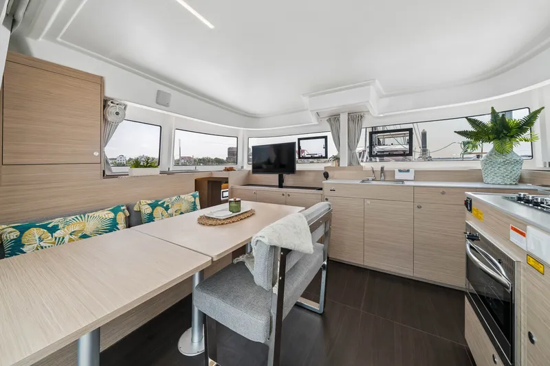 Slide: The Image of Modern interior of 2026 Lagoon 38 catamaran with sleek kitchen and dining area. - 59