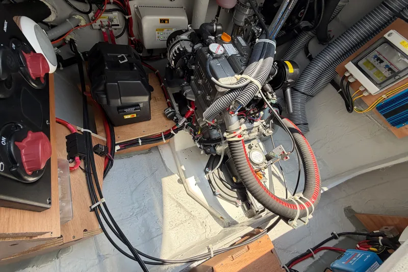 Slide: The Image of Engine compartment of a 2026 Lagoon 38 boat, showcasing wiring and mechanical components. - 120