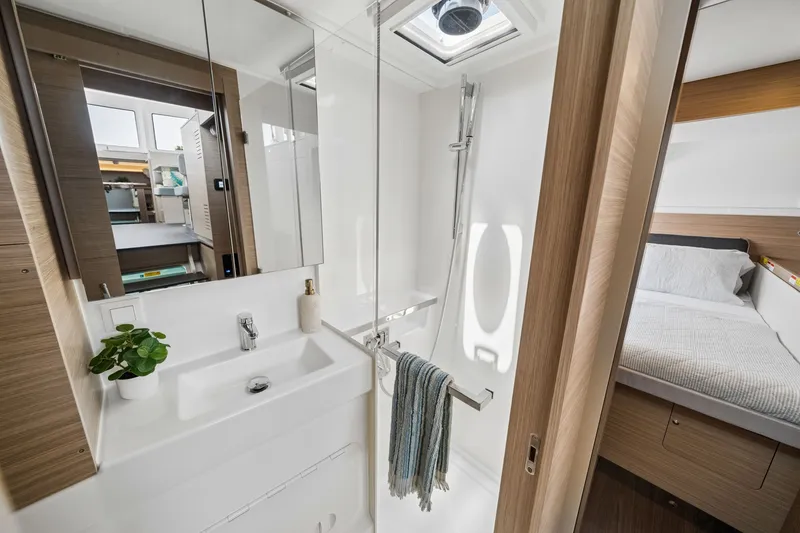 Slide: The Image of Modern bathroom interior on 2026 Lagoon 38 yacht, featuring sleek design and natural light. - 77