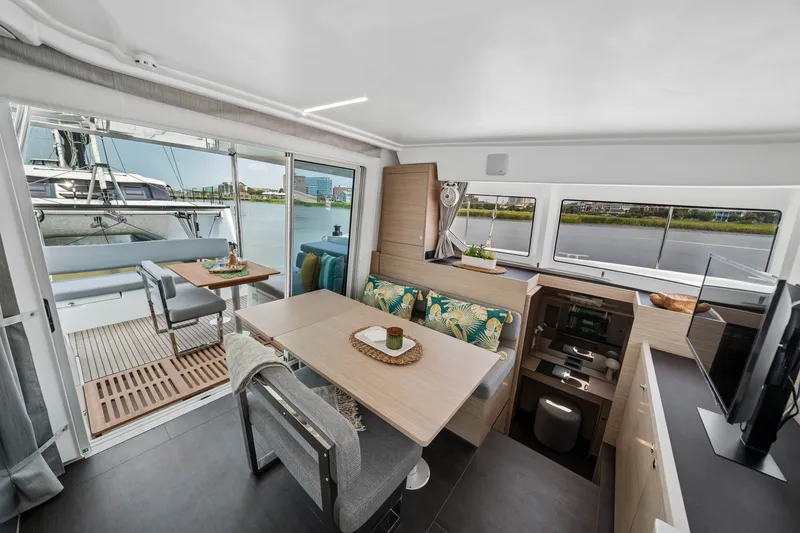 Slide: The Image of Modern interior of 2026 Lagoon 38 catamaran with dining area and scenic water views. - 47