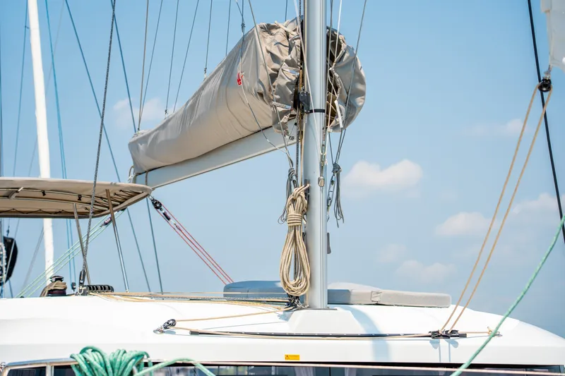 Slide: The Image of 2026 Lagoon 38 catamaran mast and rigging against a clear blue sky. - 28