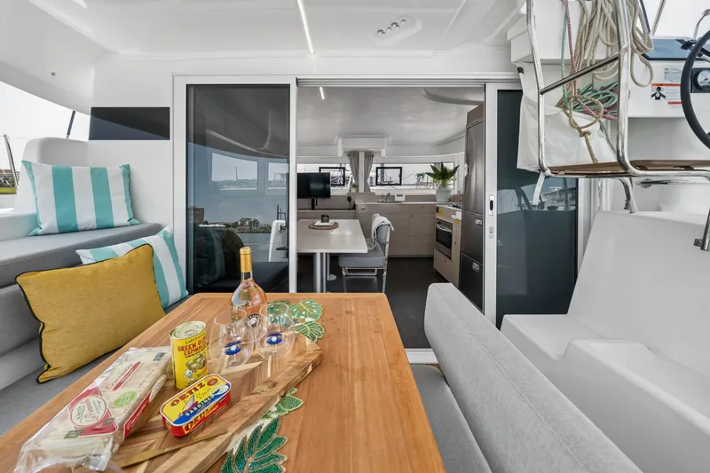 Slide: The Image of Modern Lagoon 38 catamaran interior with dining area, kitchen, and nautical decor, 2026 model. - 45