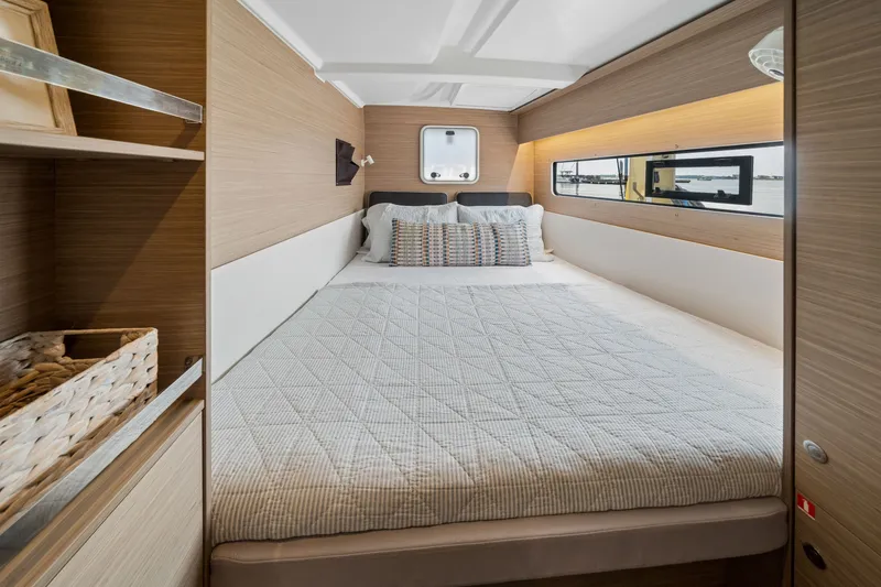 Slide: The Image of Luxurious cabin interior of 2026 Lagoon 38 yacht with cozy bed and modern design. - 76