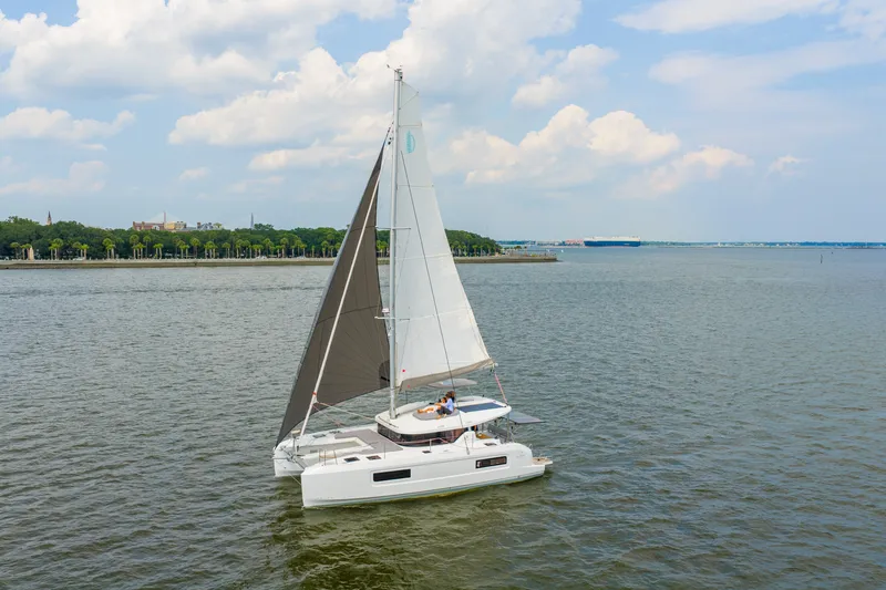 Slide: The Image of Sailing Lagoon 38 catamaran on calm waters, 2026 model, under a partly cloudy sky. - 97