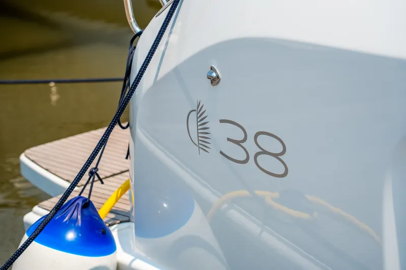 Slide: The Image of 2026 Lagoon 38 catamaran docked, featuring sleek design and modern logo. - 29