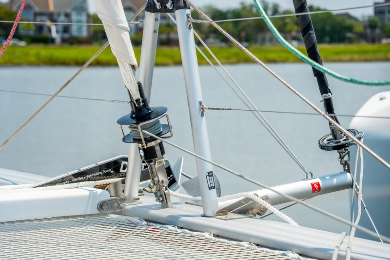 Slide: The Image of Close-up of 2026 Lagoon 38 sailboat rigging and deck details by the water. - 21
