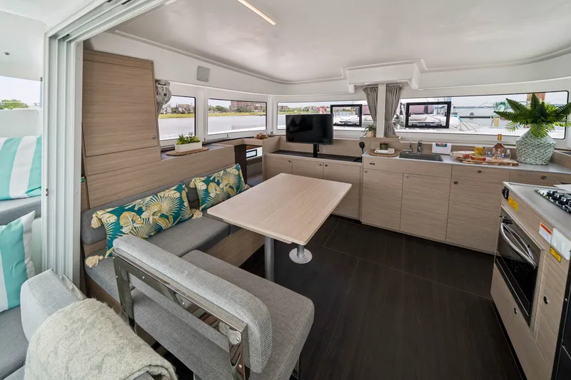 Slide: The Image of Modern interior of 2026 Lagoon 38 catamaran with kitchen and seating area. - 56