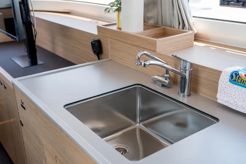 Slide: The Image of Modern kitchen sink in 2026 Lagoon 38 yacht, featuring sleek design and stainless steel finish. - 50
